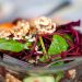 Vibrant beetroot and spinach salad with walnuts, perfect for a healthy meal.